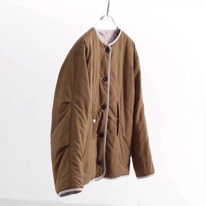 Women's quilted jacket without collar with oversized silhouette and contrast piping Mune Fashion