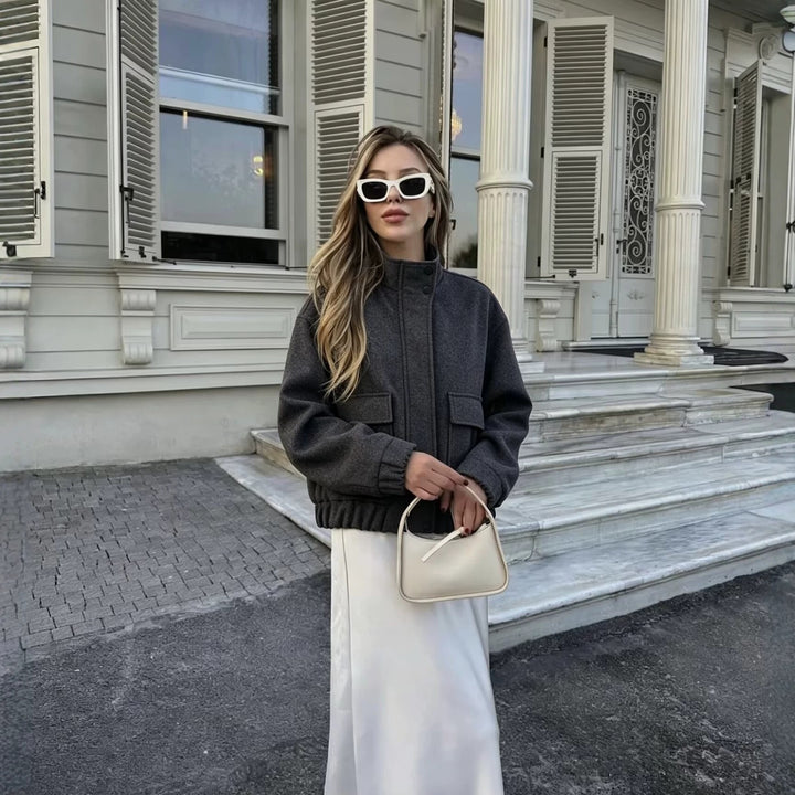 Women's wool blend blouson jacket with stand-up collar, large flap pockets, and elastic hem Mune Fashion