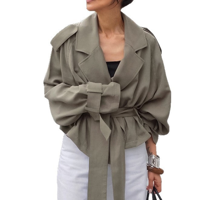 Women non-woven cropped jacket with oversized raglan sleeves and wide tie belt Mune Fashion