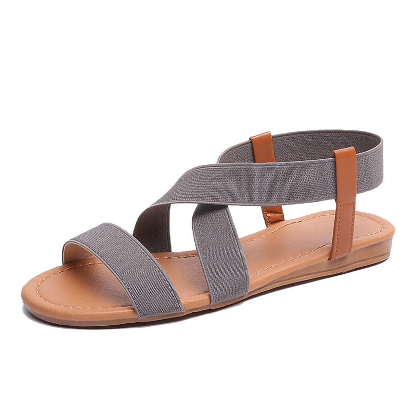 Women's flat elastic strap sandals with crossed stretch bands and padded comfort footbed Mune Fashion