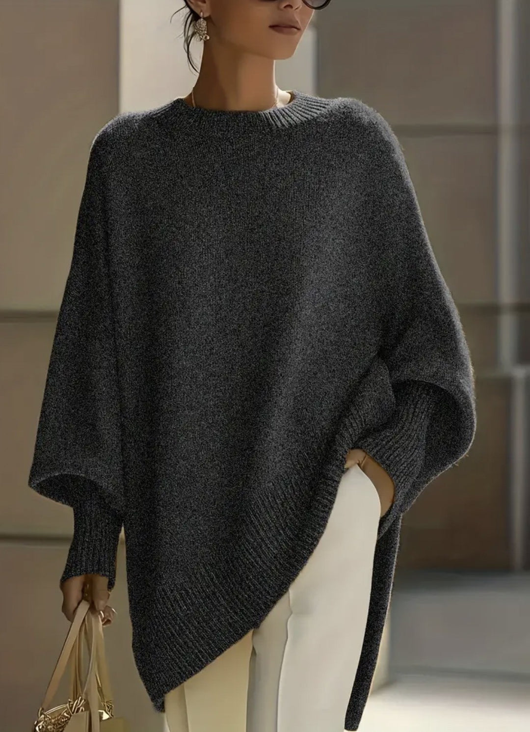 Women's oversized knit poncho with asymmetrical hem and ribbed sleeves Mune Fashion
