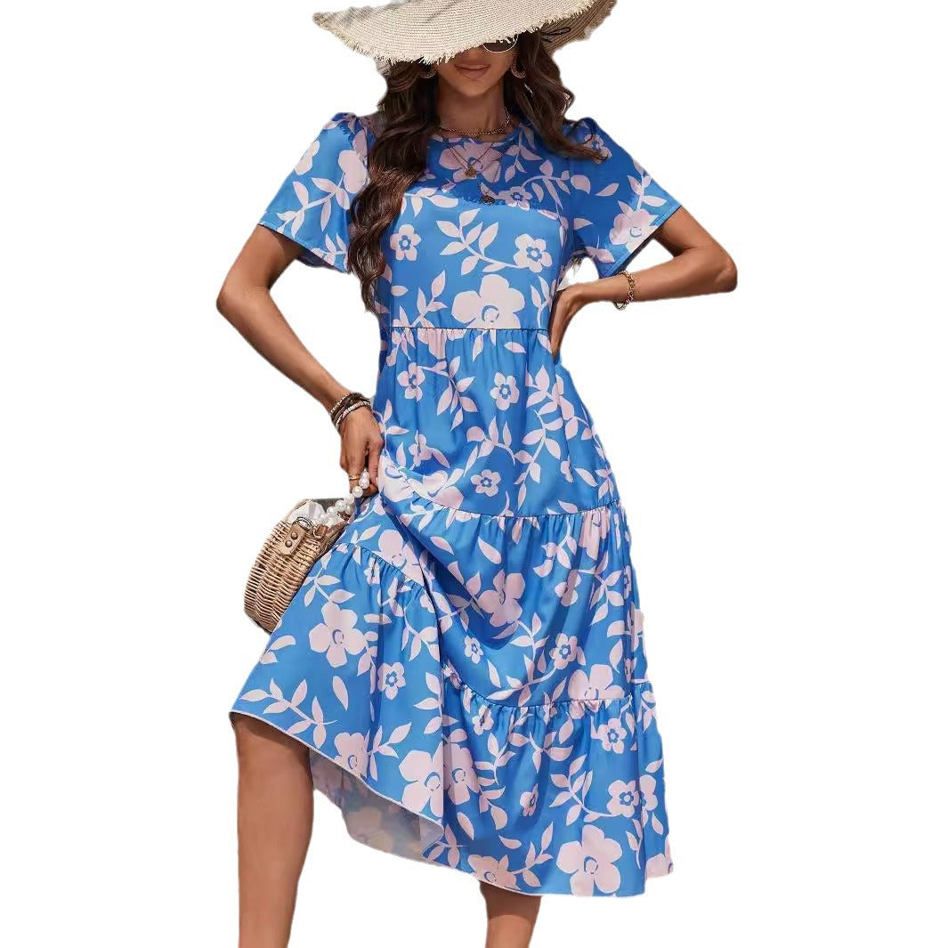 Ladies airy tiered midi dress with high waist seam, short sleeve and all-over floral pattern Mune Fashion