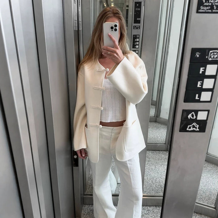 Women's short coat with Chinese toggle closures, oversized sleeves, and patch pockets Mune Fashion