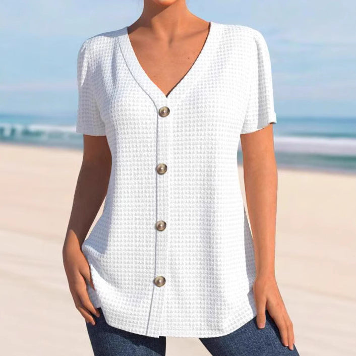 Women's finely structured V-neck top with decorative button placket and slightly flared silhouette Mune Fashion