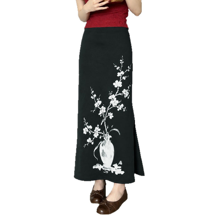 Women's flared maxi skirt with A-line cut, elastic waistband, and floral watercolor vase print Mune Fashion