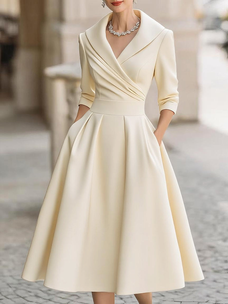 Women's elegant midi dress with wrap top, three-quarter sleeves, and side pockets Mune Fashion