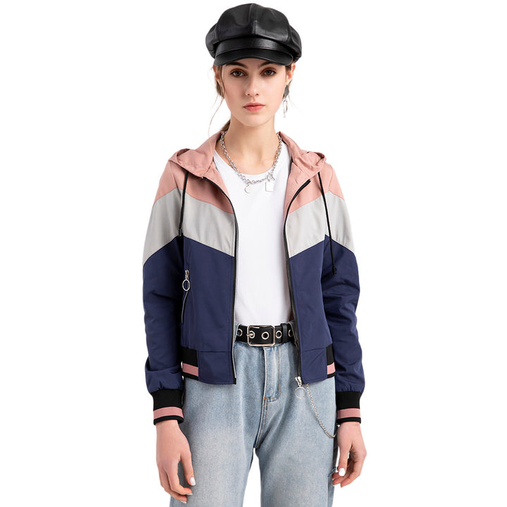 Women's lightweight windbreaker jacket with hood, block panel design, zippered pockets, and elastic hem Mune Fashion