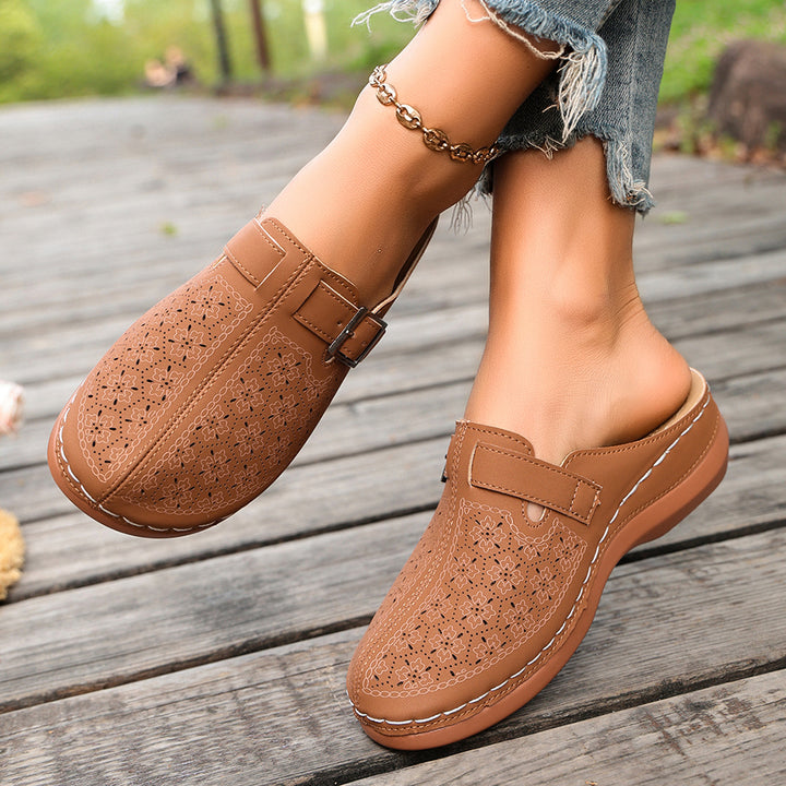 Women's comfort mule with adjustable buckled strap and ornamental hole embossing Mune Fashion