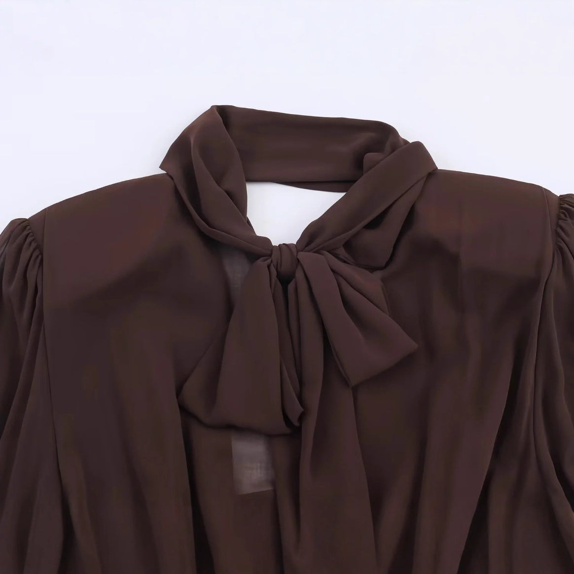 Women's fitted mini dress with bow tie, pleated top, and long cuffed sleeves Mune Fashion