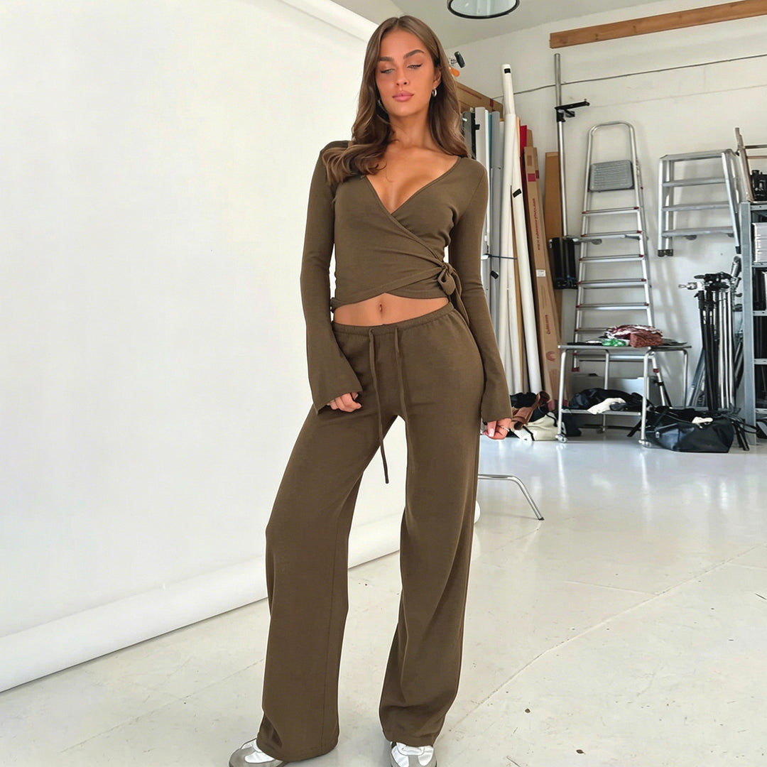 Women's wrap cropped top with deep V-neck, fitted wrap shape, and long bell sleeves Mune Fashion