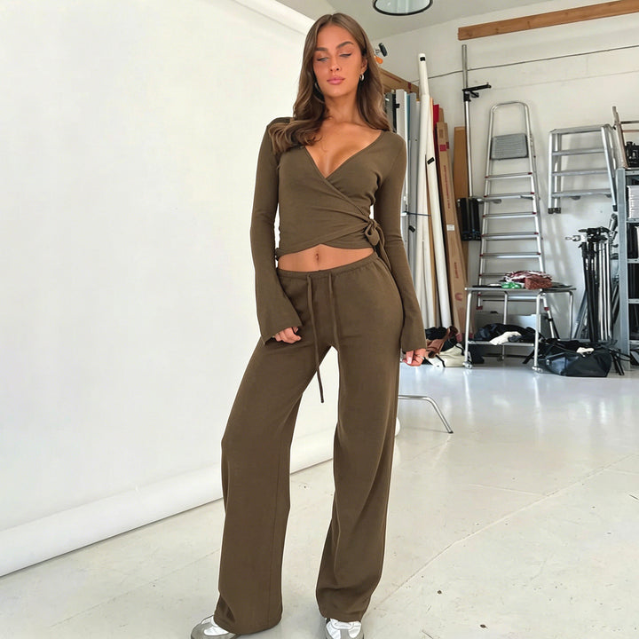 Women's wrap cropped top with deep V-neck, fitted wrap shape, and long bell sleeves Mune Fashion