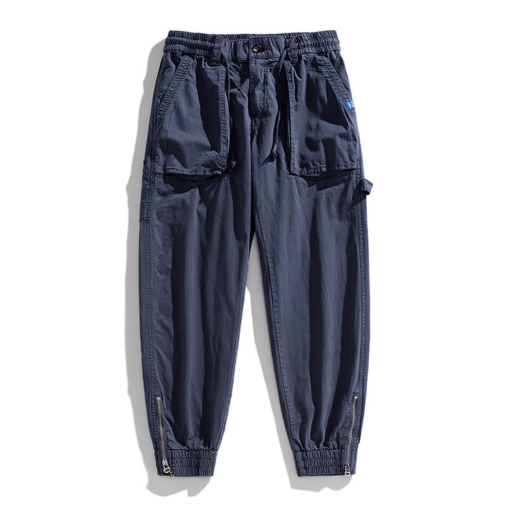 Men's workwear cargo pants in tech jogger style with applied front pockets, hammer loop, and ankle zippers Drune