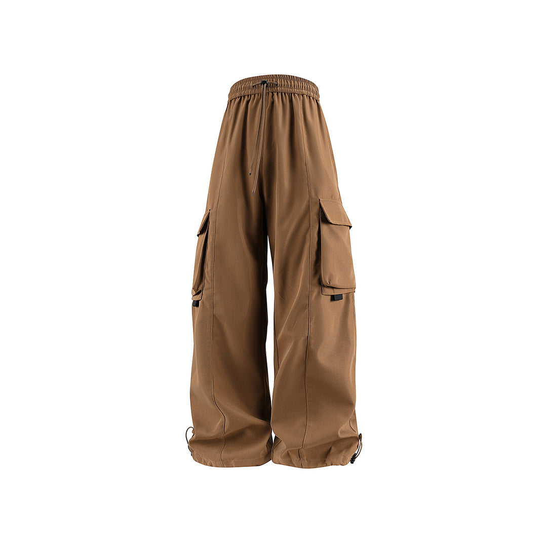 Men's wide utility cargo pants in baggy cut with drawstring waistband, large flap pockets, and adjustable leg hems Drune