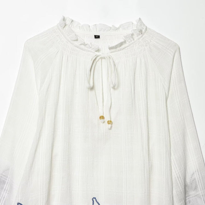 Women's embroidered cotton tunic with ruffle collar, smocking details and tie band