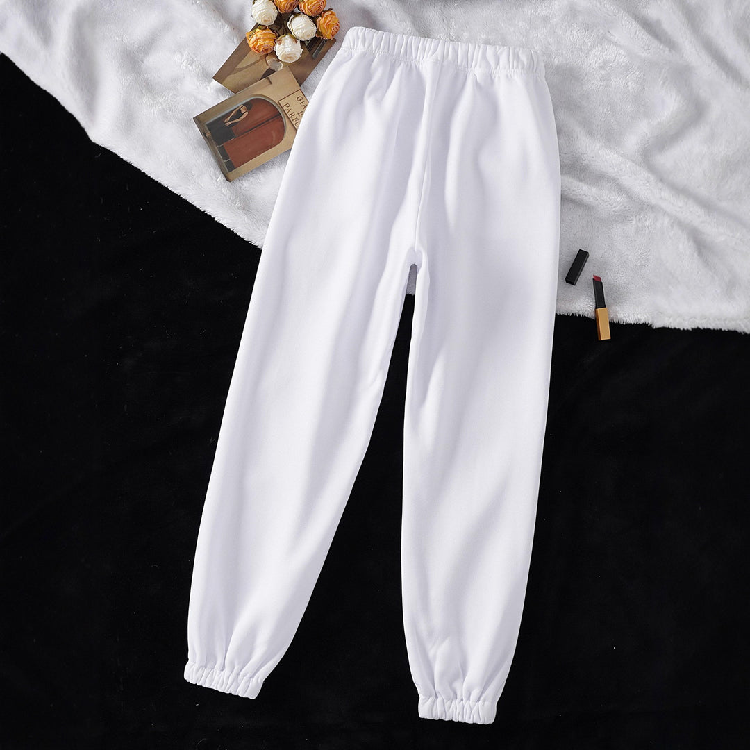 Women's high-cut joggers made of soft fleece cotton blend with elastic waistband, drawstring, and side pockets Mune Fashion