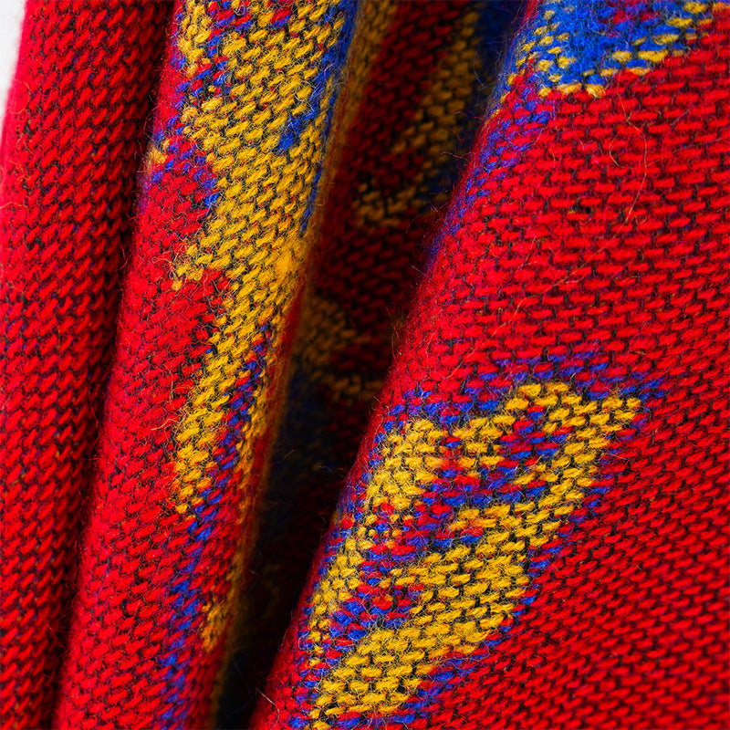 Women's jacquard poncho made of wool blend with floral pattern and overlock edge
