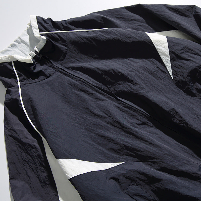 Unisex Lightweight Boxy Hooded Jacket in Windbreaker Style with Contrast Panels and Raglan Sleeves Mune Fashion
