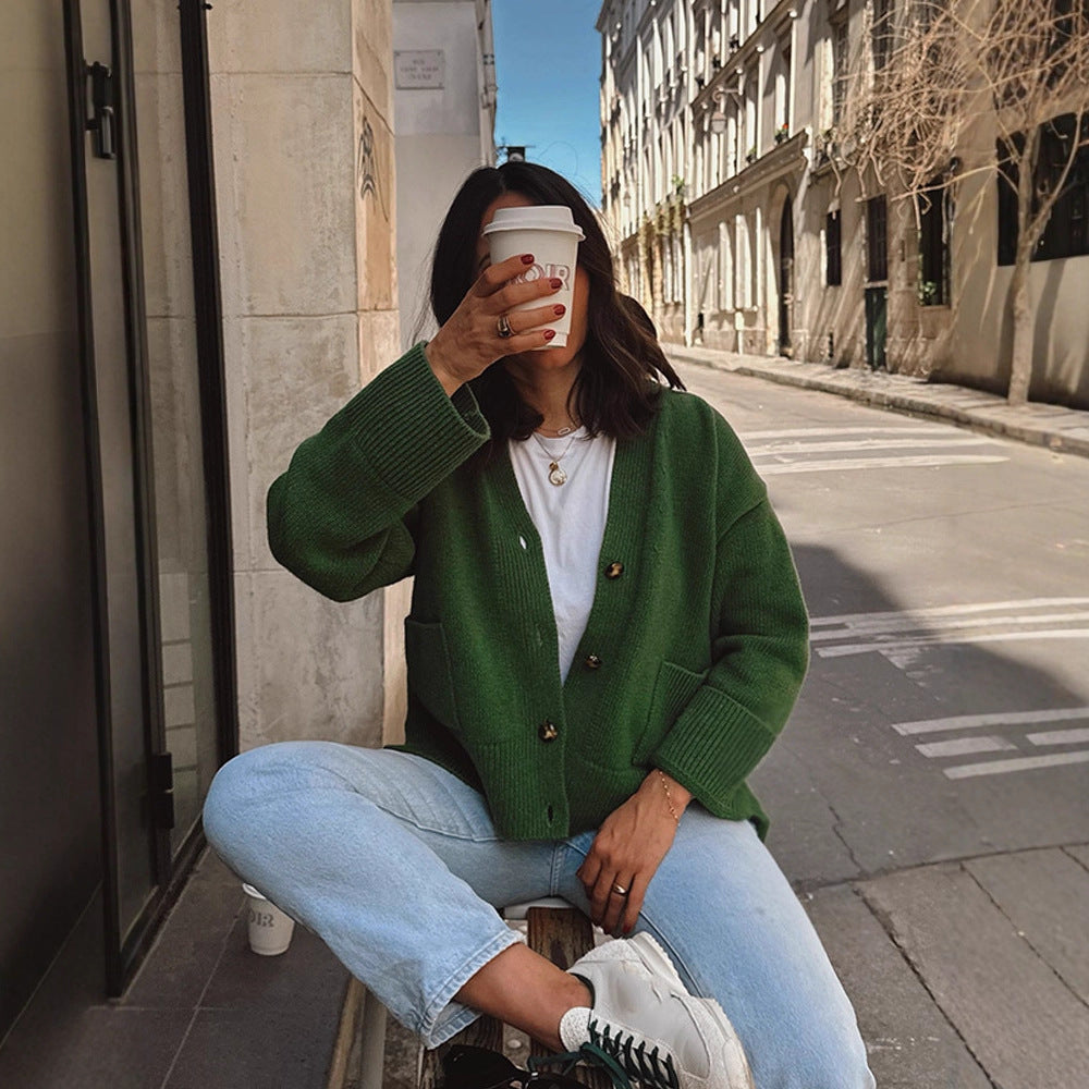 Women's oversized knit cardigan with decorative button placket, patch pockets, and elongated cuffs Mune Fashion