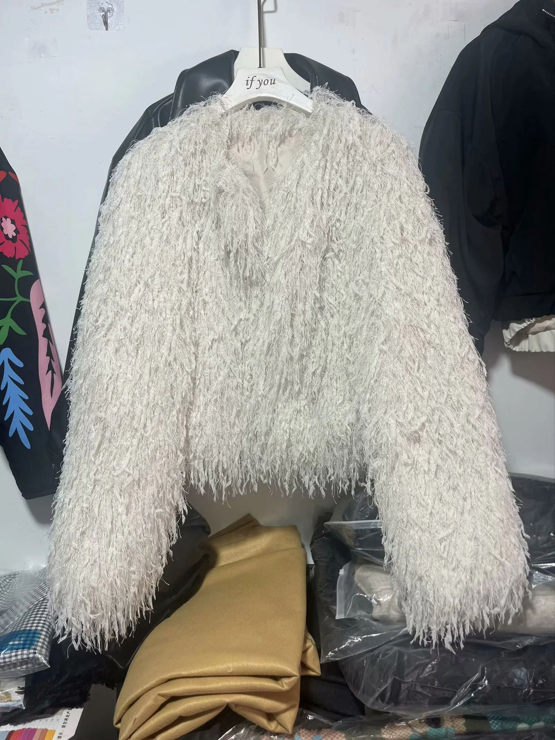Women's short faux fur jacket with shaggy fringe texture, soft lining and boxy cropped cut Mune Fashion