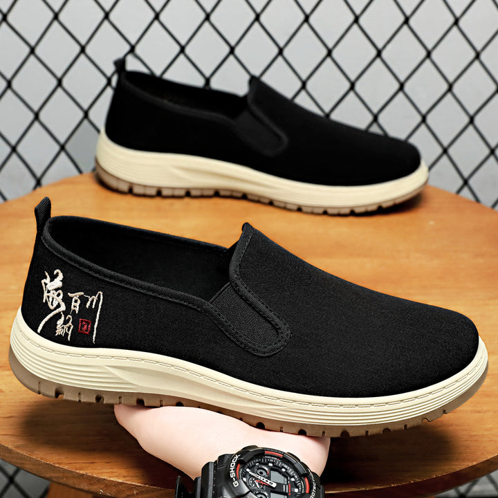 Men's seamless canvas slip-on with elastic entry, embroidered heel motif and slip-resistant EVA outsole Mune Fashion