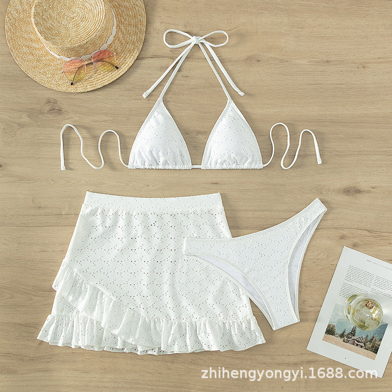 Women's triangle bikini with playful hole pattern and matching skirt Mune Fashion