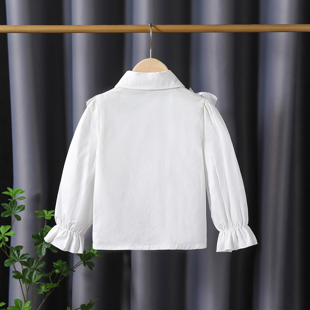 Girls blouse with ruffle details and elegant puff sleeves Mune Fashion