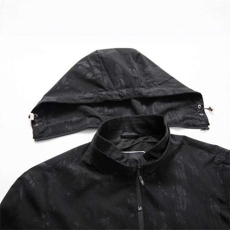 Men's lightweight softshell transitional jacket with hood, water-repellent coating and reflective zippered pockets Mune Fashion
