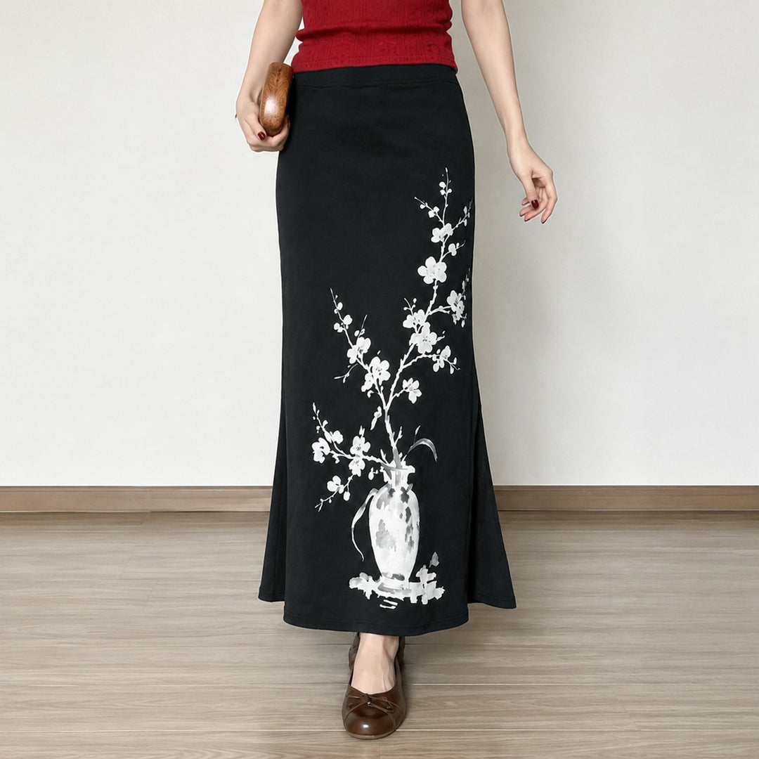Women's flared maxi skirt with A-line cut, elastic waistband, and floral watercolor vase print Mune Fashion