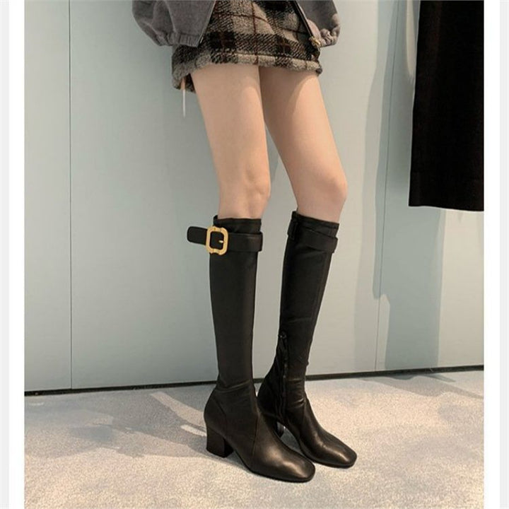 Women knee-high vintage-inspired boots with sculpted block heel, adjustable buckle strap, and side zipper Mune Fashion