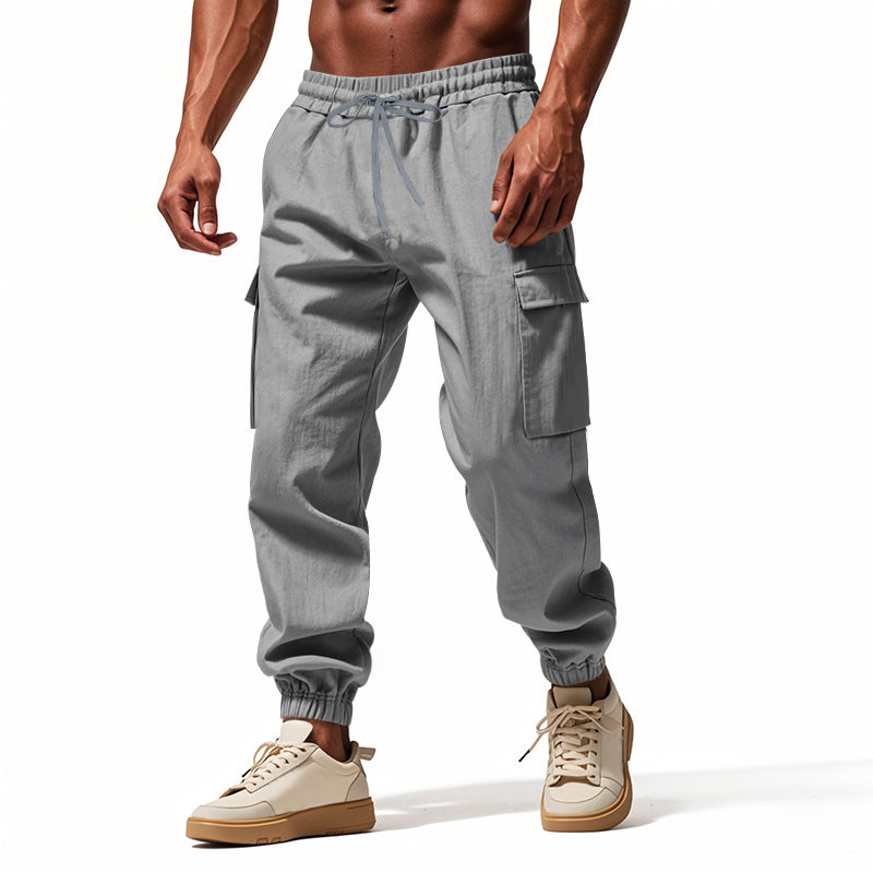 Men's tapered joggers in utilitarian style with elastic waistband, drawstring, and flap pockets Mune Fashion