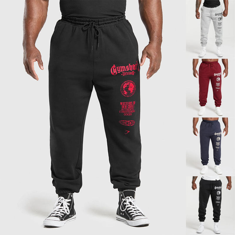 Men's tapered cotton fleece sweatpants with an elastic drawstring waistband, ribbed leg openings, and large logo print Mune Fashion