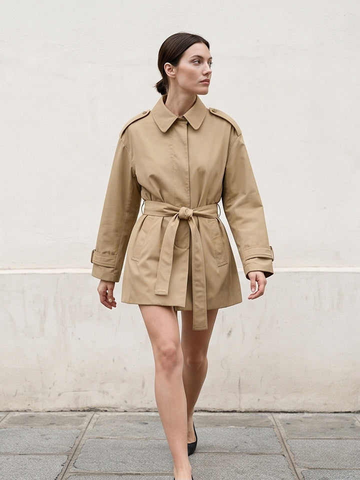Women's short trench coat with waist belt, shoulder flaps, and adjustable cuffs Mune Fashion