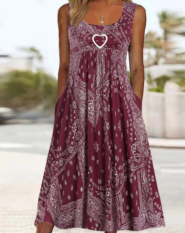 Women's airy maxi dress with paisley bandana print, gathered empire waist and practical side pockets Mune Fashion