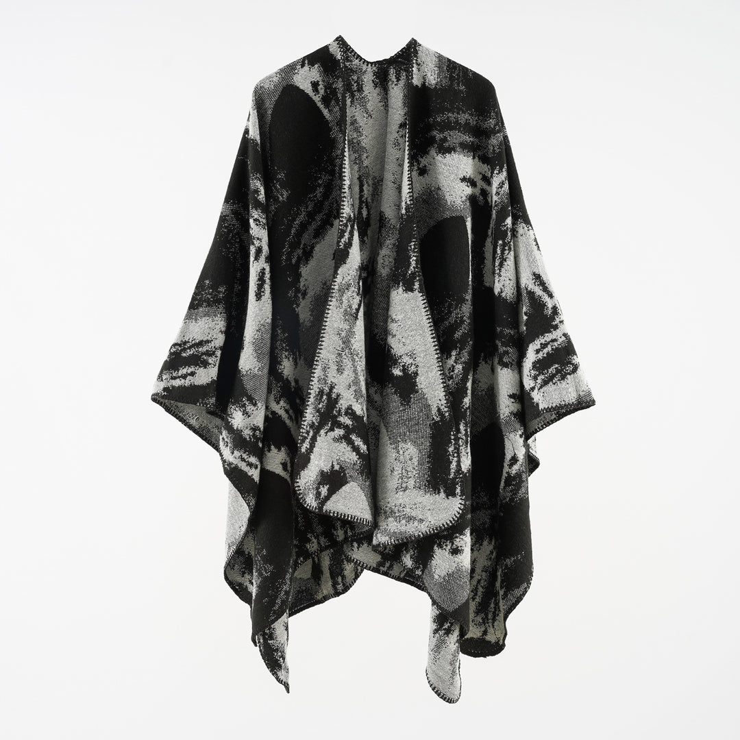 Ladies oversized jacquard cape made of wool blend with graphic watercolor pattern and overlock edge Mune Fashion