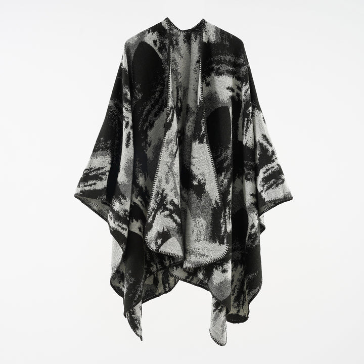 Ladies oversized jacquard cape made of wool blend with graphic watercolor pattern and overlock edge Mune Fashion