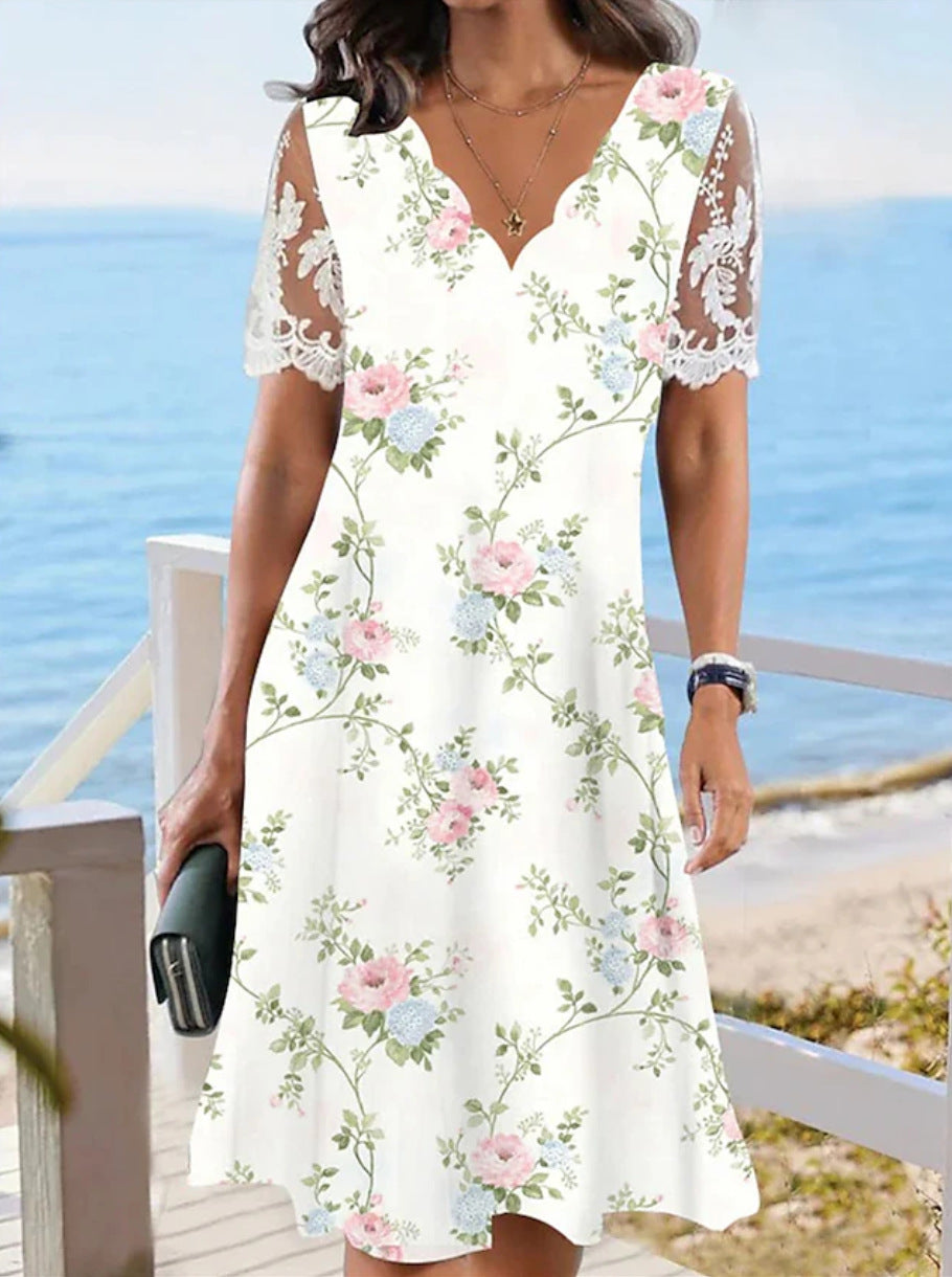 Women's A-line midi dress with wavy V-neck, all-over floral pattern and transparent lace sleeves Mune Fashion