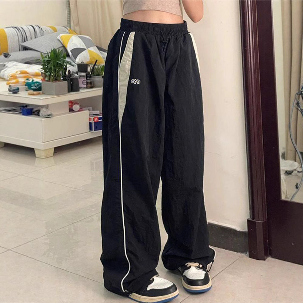 Women's wide track pants with contrast piping, elastic waistband and oversized fit Mune Fashion