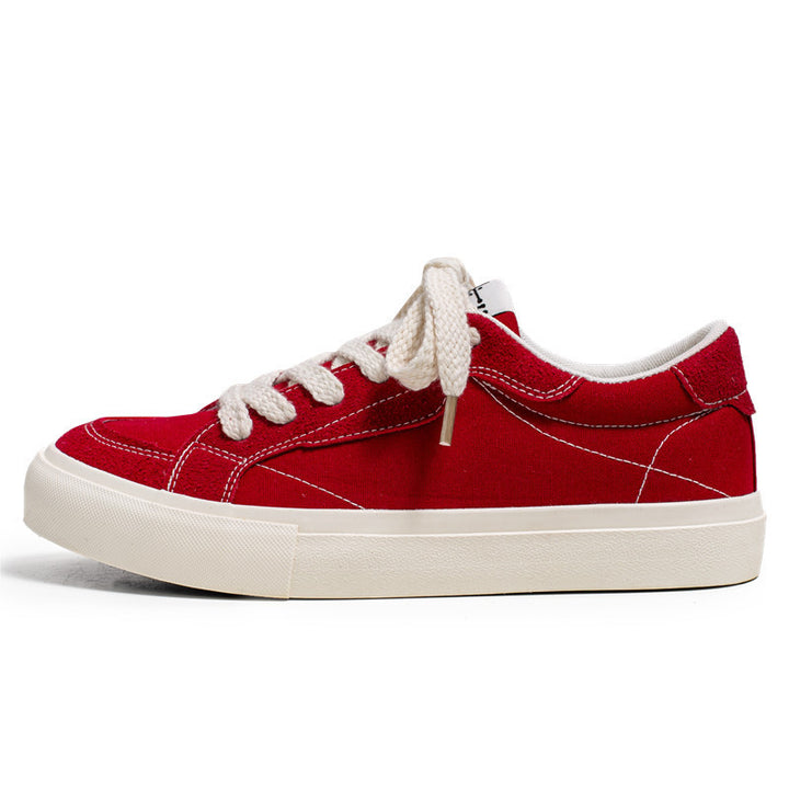 Unisex casual canvas low-top sneaker with contrasting decorative stitching and padded platform sole Mune Fashion
