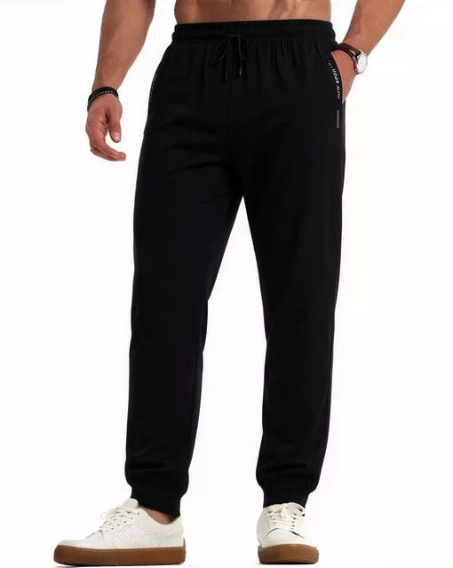 Men's sporty jogging pants with elastic waistband and practical side pockets Mune Fashion