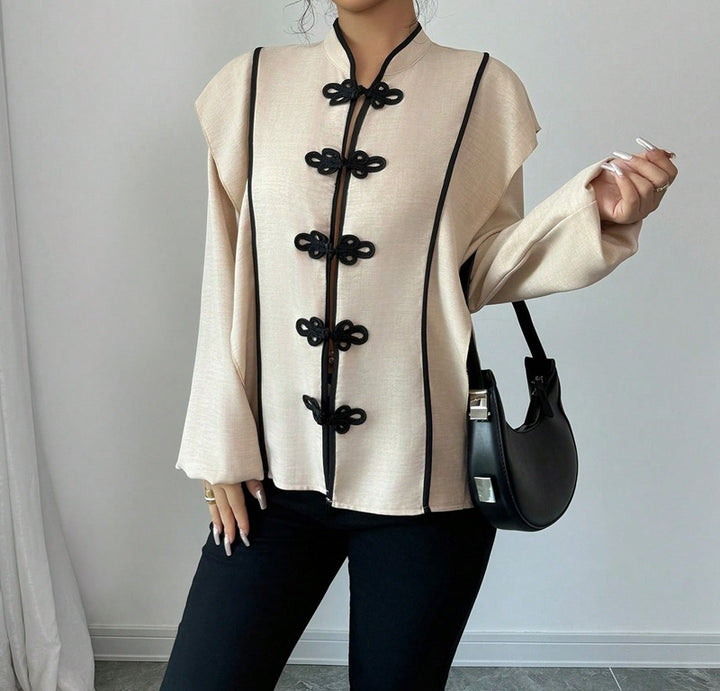 Women's stand-up collar blouse with decorative knot closures and decorative piping Mune Fashion