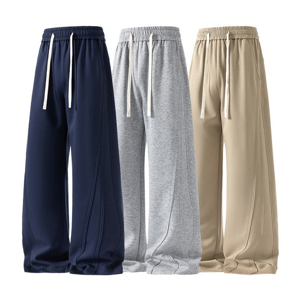 Women's wide lounge sweatpants with elastic drawstring waistband and decorative side seam details Mune Fashion