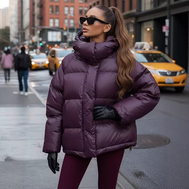 Ladies short padded oversized quilted jacket with high standing collar and hood Mune Fashion