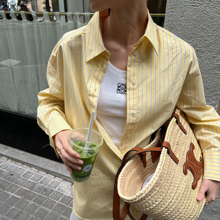 Women's loose oversized shirt blouse with classic collar, full button placket, and rounded hem Mune Fashion