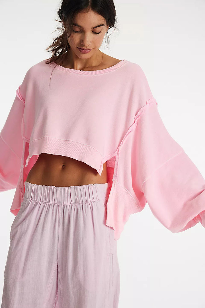 Women's cropped oversized sweatshirt with thumb hole, frayed hem, and wide raglan sleeves Mune Fashion
