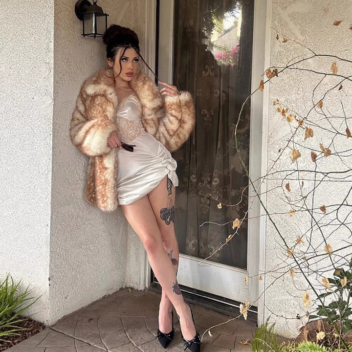 Women Mid-length plush faux fur coat with voluminous shawl collar and boxy silhouette Mune Fashion