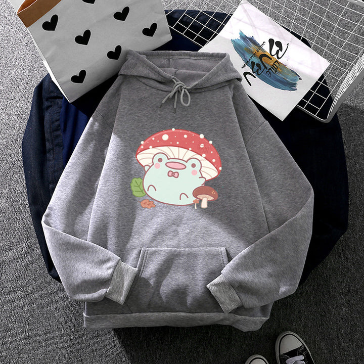 Women’s soft oversized hoodie with kawaii mushroom frog print, kangaroo pocket, and ribbed cuffs Mune Fashion