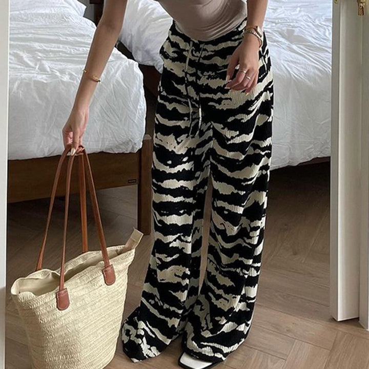 Ladies wide pleated trousers with zebra pattern, elastic drawstring and flowing jersey feel Mune Fashion