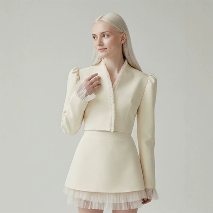 Ladies short blazer with tailored cropped silhouette, gathered shoulders and delicate tulle cuffs Mune Fashion