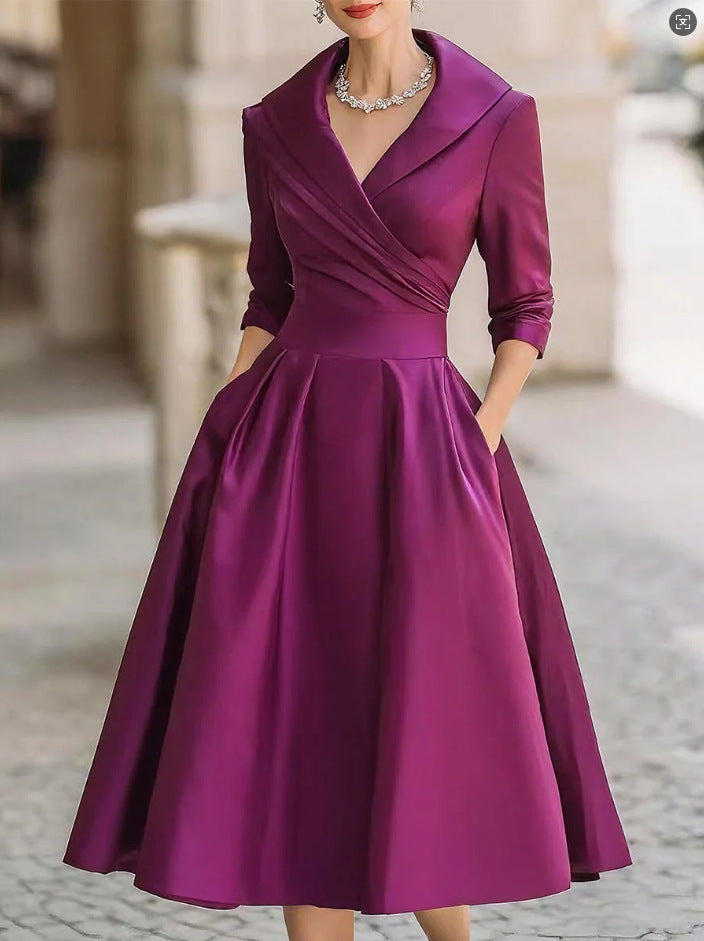 Women's elegant midi dress with wrap top, three-quarter sleeves, and side pockets Mune Fashion