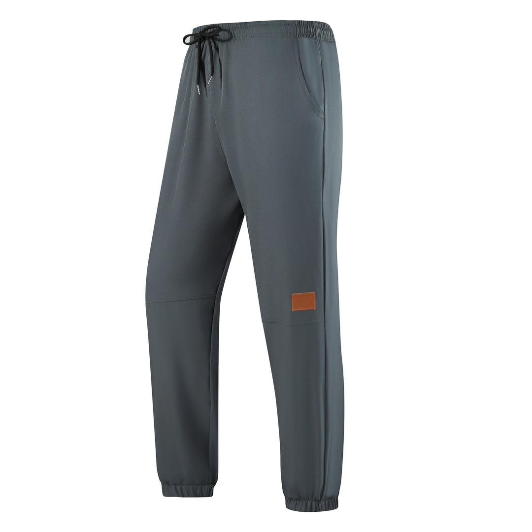 Men's sporty casual pants with elastic waistband and multifunctional pockets Mune Fashion